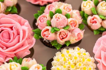 Delicious Gourmet Cupcakes Topped with Buttercream Frosting Flowers