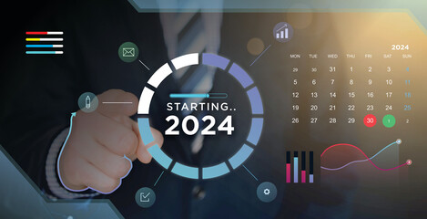 businessman starts 2024 with data analysis for new calendar and new work