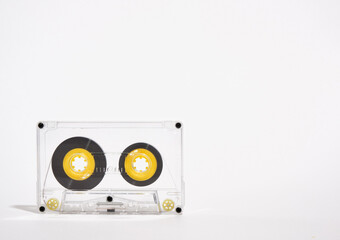 Idea of disco and party. Image of transparent audio cassette on white background. Copy space for...