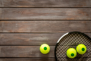 Close up of tennis racquet and balls, top view. Sport games background
