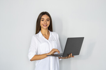 Young pretty woman with laptop on white background