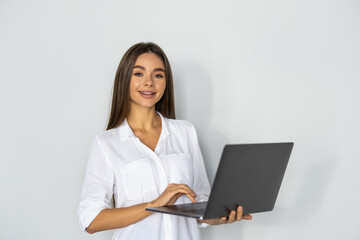 Young pretty woman with laptop on white background