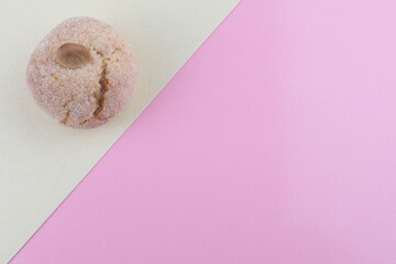 Typical Sardinian soft almond biscuits, on the table white and pink colors, copy space for text.
