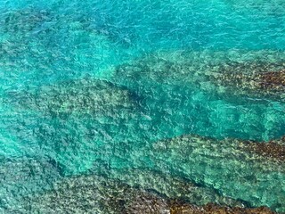 Sea blue turquoise glittering water background aerial view