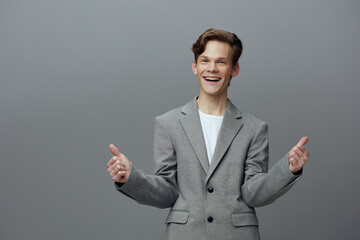 Confident Young Man with a Happy Smile in Modern Studio - A Handsome Caucasian Model Exhibiting...