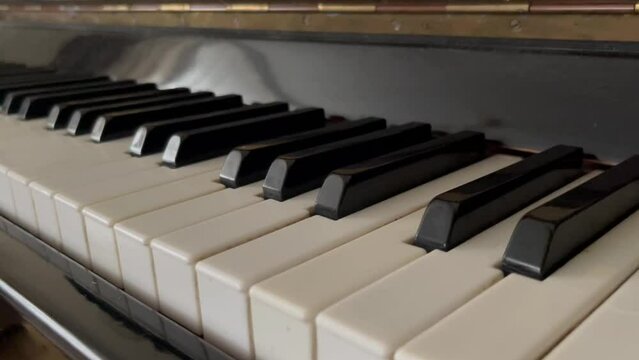 Close up view of a keyboard of a pld piano	