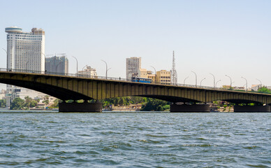 bridge over the river Nile and high houses in Cairo