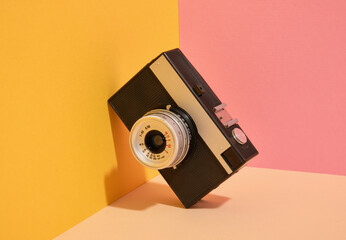 Black retro camera. Vintage composition.