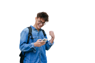 Grateful smart teen boy in jeans shirt received great. News  in message smiles clenches fist like winner against transparent background excited by passed exams. Mockup, success, happy people