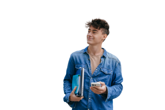 Satisfied guy in jeans shirt holding notebook, folders and phone looks aside standing against transparent background, passed exam. Smart teen boy goes to university. Education