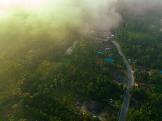 Aerial view rural road tropical rainforest village morning sunrise