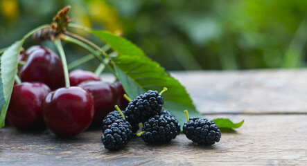 Cherries and various fruits on the board