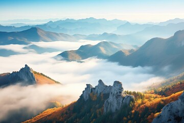 misty mountain range with peaks visible above fog