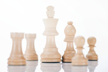 white wooden chess figures white