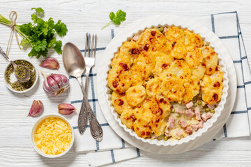 au gratin potatoes with diced ham and green peas