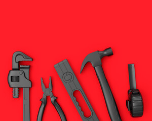 Top view of monochrome construction tools for repair on red background