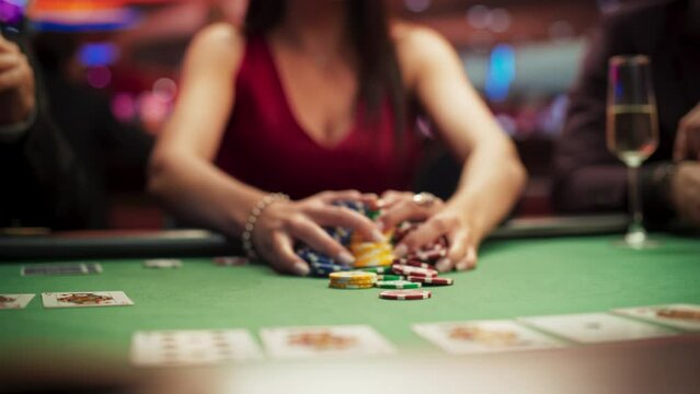 Anonymous Glamorous Woman in a Evening Dress Collecting her Prize of Poker Chips in a Luxury Casino. Lucky Female Winner Hitting the Jackpot, Happy and Rich. Slow motion