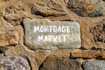 Mortgage market symbol. Concept words Mortgage market on beautiful grey stone. Beautiful brown stone wall background. Business mortgage market concept. Copy space.