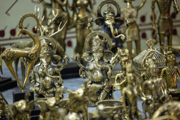Brass metal art, Handmade Indian god Ganesh sculpture souvenir made with brass with blur background. Selective focus.