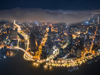Aerial photo of downtown Ho Chi Minh City, Vietnam's largest city with high-rise buildings next to the riverbank.