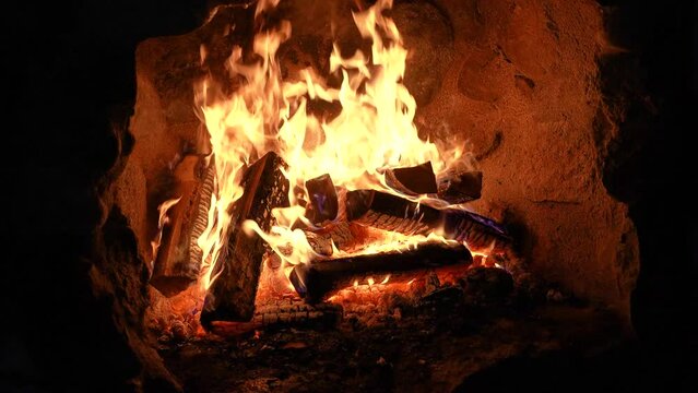 Wood burning in a stone fireplace