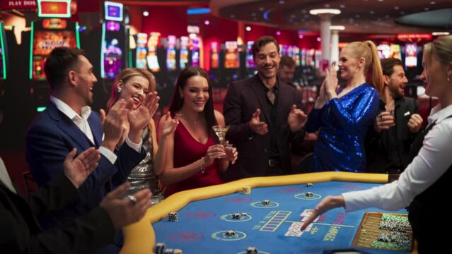 Glamorous Casino Gamlers Placing Bets and Having Fun while Winning at the Baccarat. Wealthy Casino Goers Playing a Baccarat Game in a VIP Club. Luxurious Lifestyle of Beautiful People