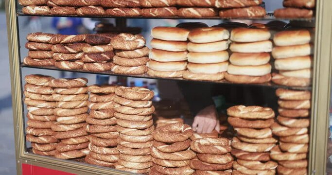 Man selling fresh traditional bread from his mobile cart in Turkey - Street food and travel concept