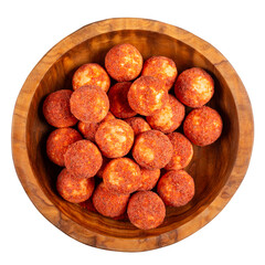 Kurt cheese with red hot pepper.  Kurt -  traditional Central Asian cheese. Small hard white cheese balls in wooden bowl isolated on white. Salty dairy snacks. Top view.