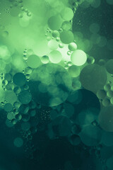 abstract green liquid background with bubbles