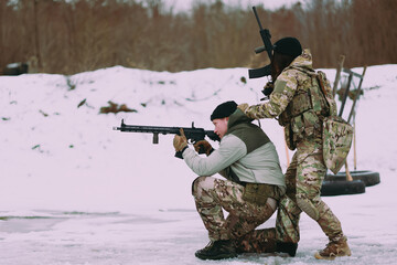 Military training. People training in tactical shooting.