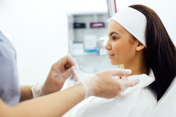 Dermatologist or cosmetologist start procedures in spa salon or clinic