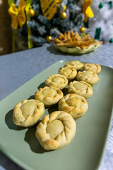 Mini chicken pastries served on a tray at a festive gathering.
