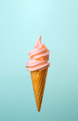 Ice cream cone with pale peach rose petals on blue background. Summer minimal concept. Flat lay.
