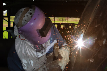 Steel welder builds technical, industrial steel welder in technical factory