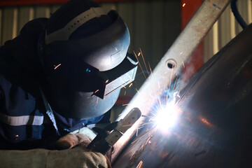 Steel welder builds technical, industrial steel welder in technical factory