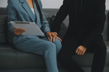 Sexsual harassment in workplace. Unhappy female employee looking at hand of boss touch at her shoulder and feeling disgusted. - obrazy, fototapety, plakaty