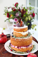 Dessert table for a party. Ombre cake, cupcakes, sweetness and flowers