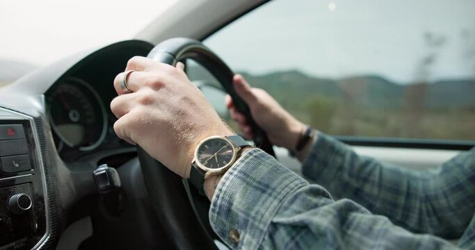 Man, hands and driving vehicle for travel, road trip or outdoor transportation in the countryside. Closeup of male person, car and steering wheel for holiday getaway, journey or adventure on street