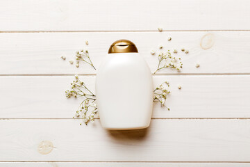 Fancy healthcare bottles for cream with gypsophila branch. Natural oranic spa cosmetics concept....