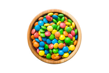 Multicolored candies in a bowl on a colored background. birthday and holiday concept. Top view with copy space