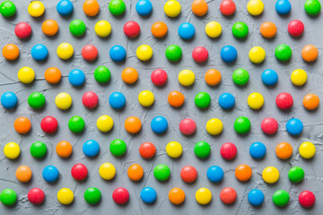 colorful candies as background top view. Seamless pattern with candy. Many sweet candies close-up