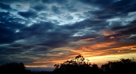 The beautiful sunset view with the blue sky and clouds in summer