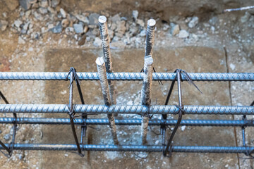 Steel reinforced concrete beams on steel foundations