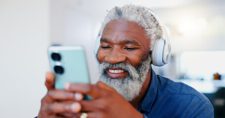 Senior black man, headphones and phone in music or audio streaming, communication or networking at home. Face of mature and happy African male person with smile listening on mobile smartphone headset - obrazy, fototapety, plakaty