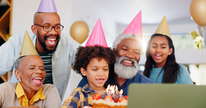 Cake, video call and family at birthday party celebration together at modern house with candles. Happy, laptop and young children with African father and grandparents for sweet dessert at home.