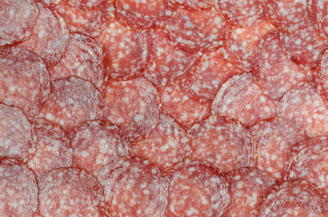 Sausage background (texture, pattern) from sausage slices.