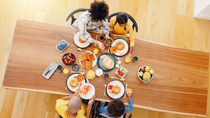 Family, food and top view of parents with children for breakfast, lunch and eating together. Meal...