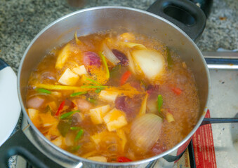 Tom Yum soup is boiling in the pot. Thailand favorite food. sour and spicy soup local food of Thailand
