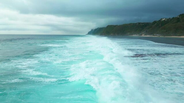 Aerial view on coast with sea and big waves on Sao Miguel Island, Azores at cloudy time.
