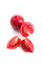 Cut and whole of pink tomato isolated on white background.
